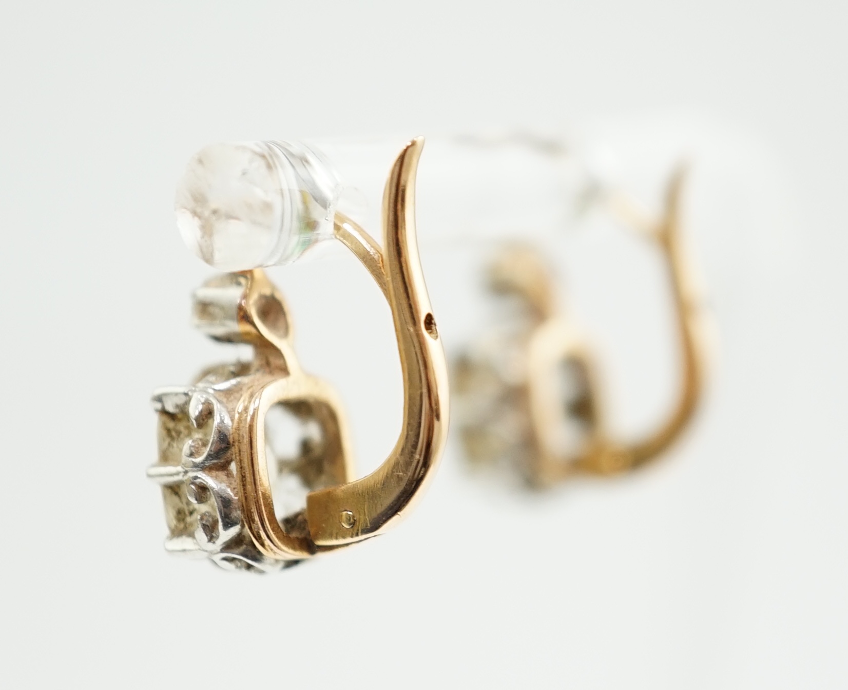 A pair of late 19th/early 20th century gold and two stone cushion cut diamond set earrings
